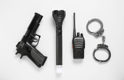 Photo of Different police equipment on white background, flat lay