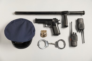 Photo of Different police equipment on white background, flat lay