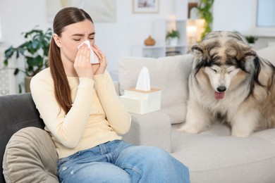 Photo of Woman suffering from allergy with her dog at home
