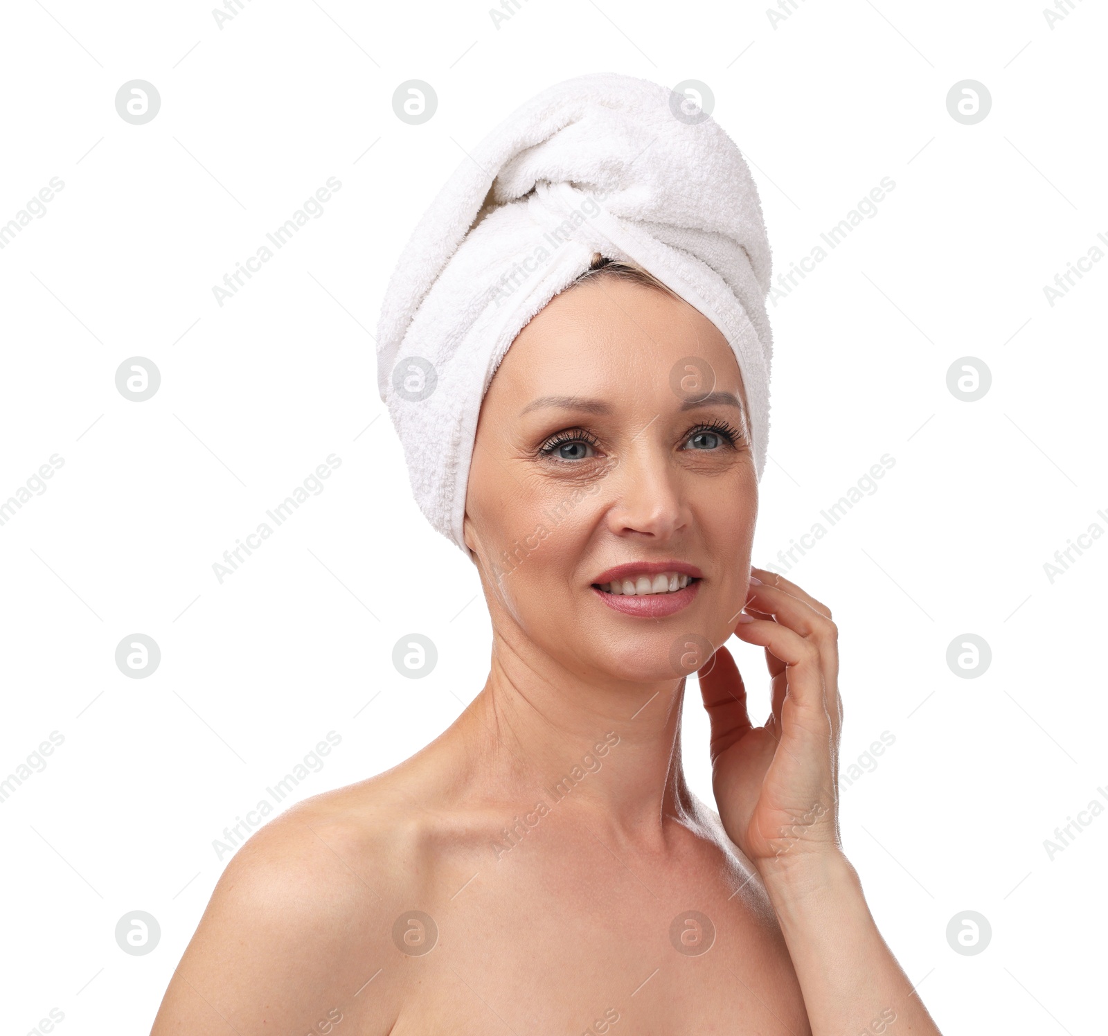 Beautiful woman with towel wrapped on her head against white background Photo of Beautiful woman with towel wrapped on her head against white background