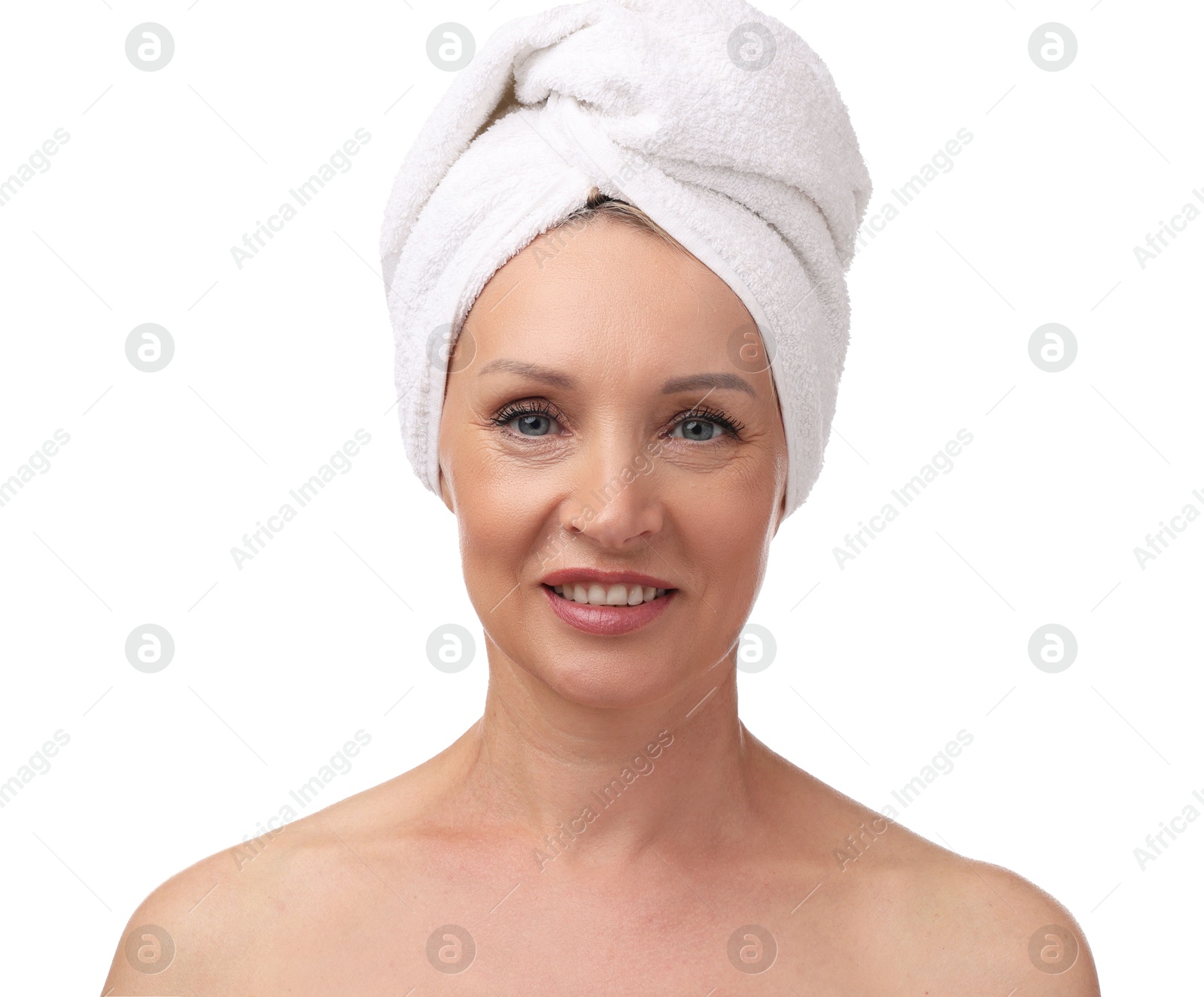 Beautiful woman with towel wrapped on her head against white background Photo of Beautiful woman with towel wrapped on her head against white background
