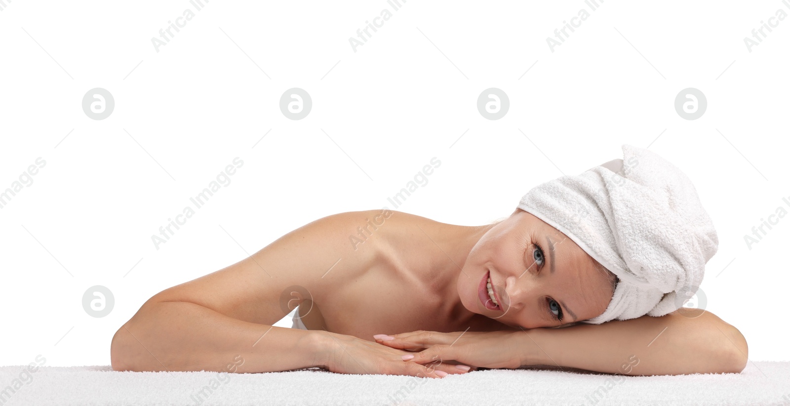 Beautiful woman with towel wrapped on her head against white background Photo of Beautiful woman with towel wrapped on her head against white background