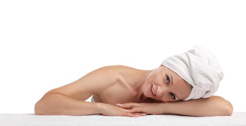 Photo of Beautiful woman with towel wrapped on her head against white background