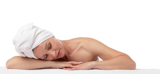 Photo of Beautiful woman with towel wrapped on her head against white background