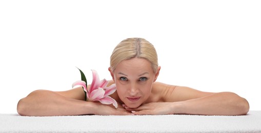 Photo of Beautiful woman with lily flower and towel on white background