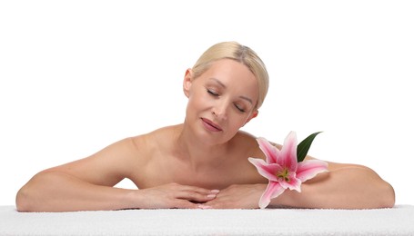 Photo of Beautiful woman with lily flower and towel on white background
