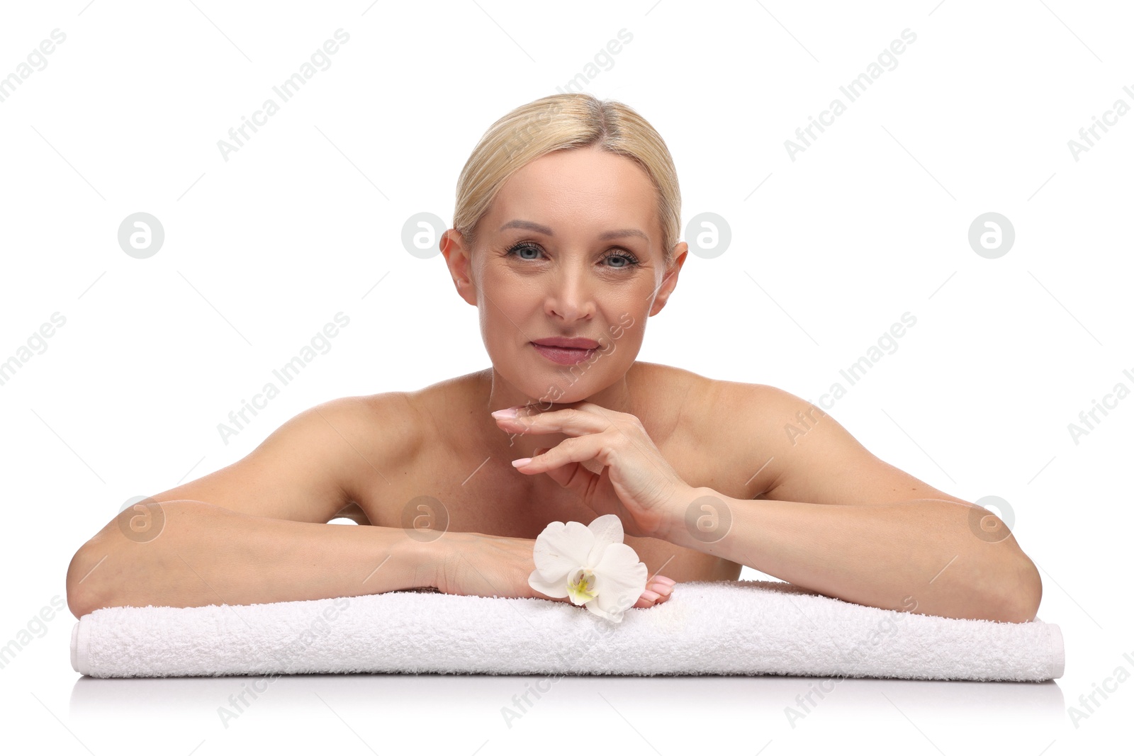 Beautiful woman with orchid flower and towel on white background Photo of Beautiful woman with orchid flower and towel on white background