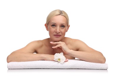 Photo of Beautiful woman with orchid flower and towel on white background