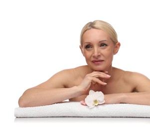 Photo of Beautiful woman with orchid flower and towel on white background
