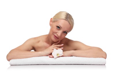 Photo of Beautiful woman with orchid flower and towel on white background