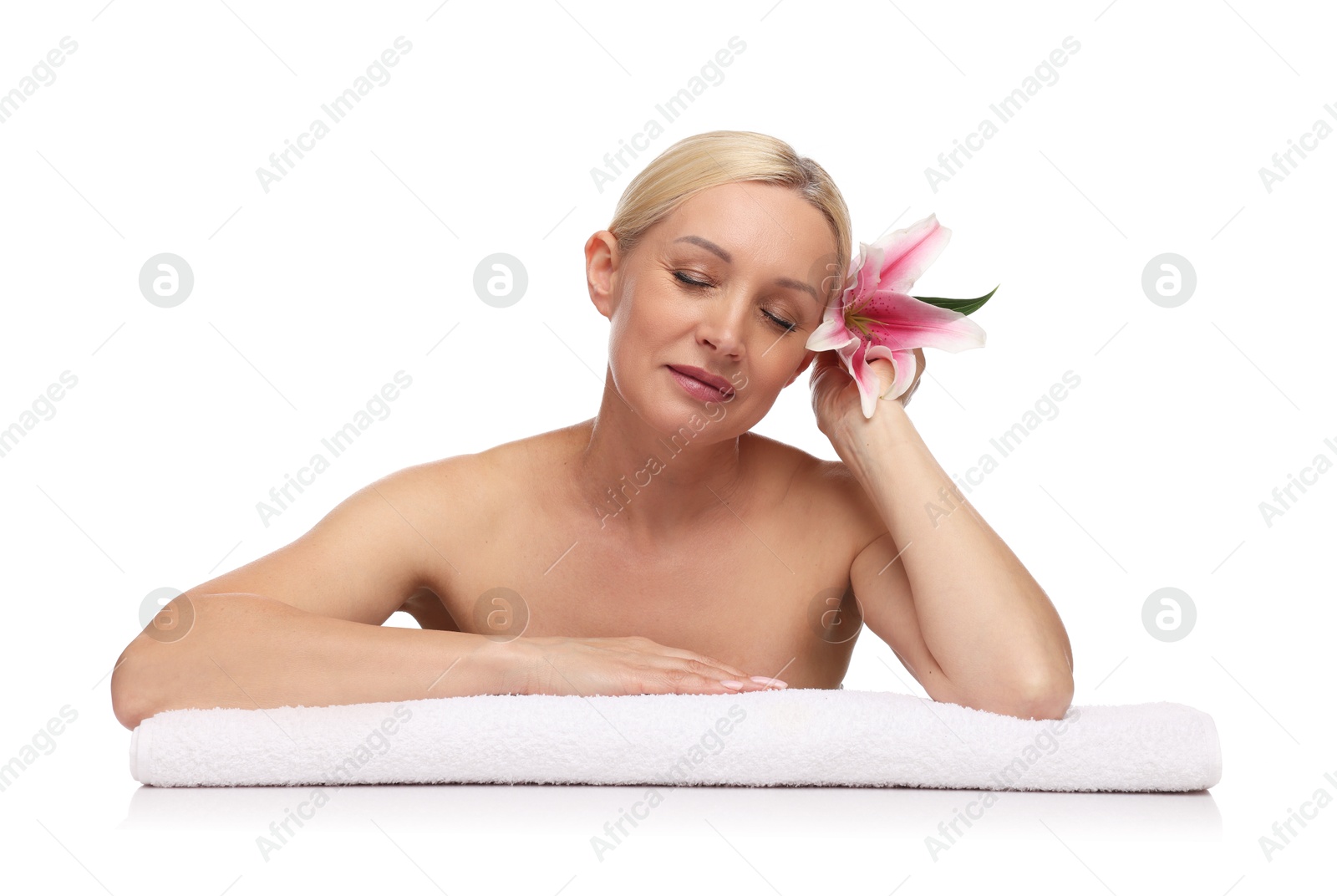Beautiful woman with lily flower and towel on white background Photo of Beautiful woman with lily flower and towel on white background