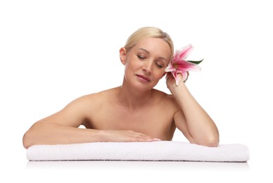Photo of Beautiful woman with lily flower and towel on white background