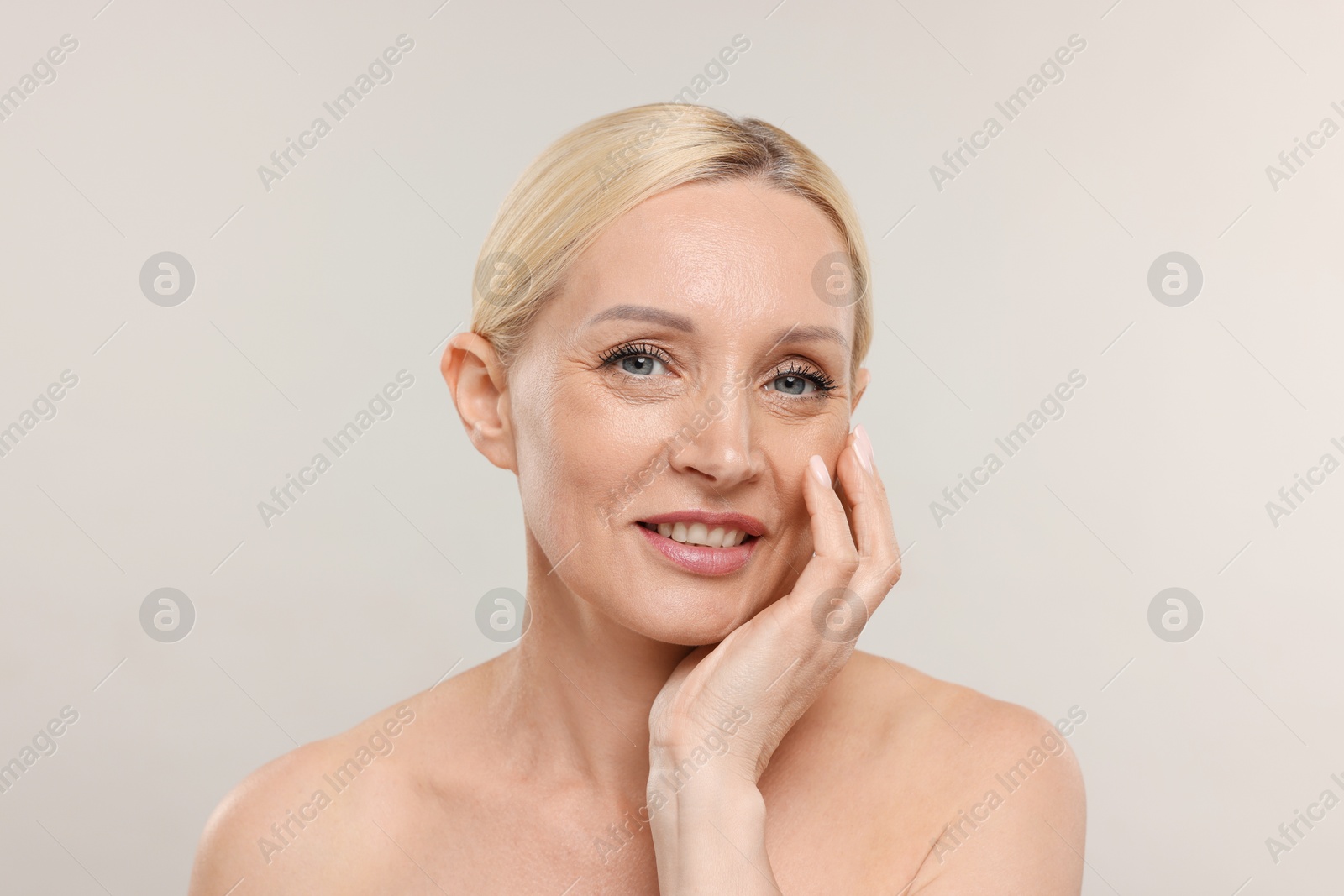 Portrait of beautiful woman on light background Photo of Portrait of beautiful woman on light background