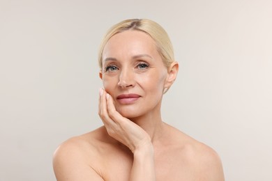 Photo of Portrait of beautiful woman on light background
