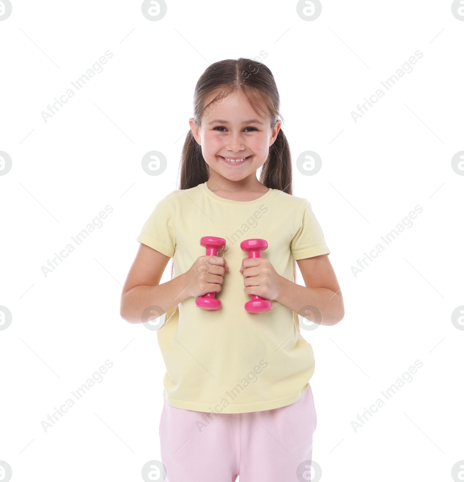 Little girl with dumbbells on white background Photo of Little girl with dumbbells on white background