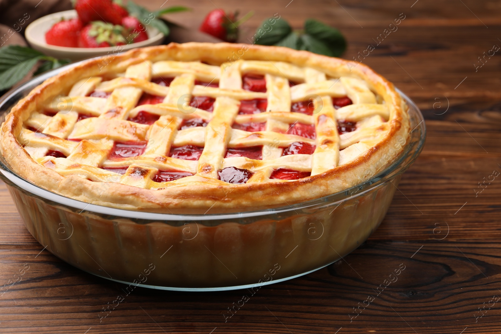 Tasty strawberry pie on wooden table, closeup Photo of Tasty strawberry pie on wooden table, closeup