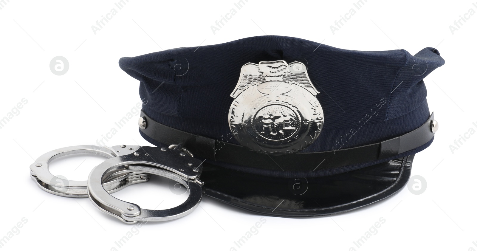 Police cap and handcuffs on white background Photo of Police cap and handcuffs on white background