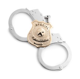 Photo of Police badge and handcuffs on white background, top view