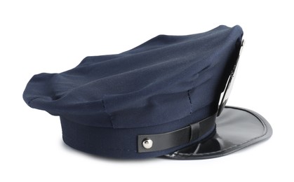 Photo of One dark blue police cap on white background