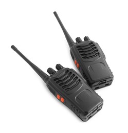 Photo of Two walkie talkies on white background, above view. Police equipment