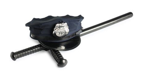 Photo of Police cap and baton on white background