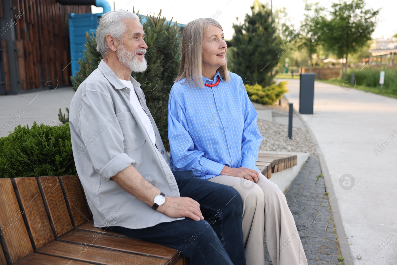 Lovely senior couple on bench in park Photo of Lovely senior couple on bench in park