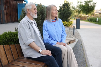 Photo of Lovely senior couple on bench in park