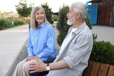 Photo of Lovely senior couple on bench in park