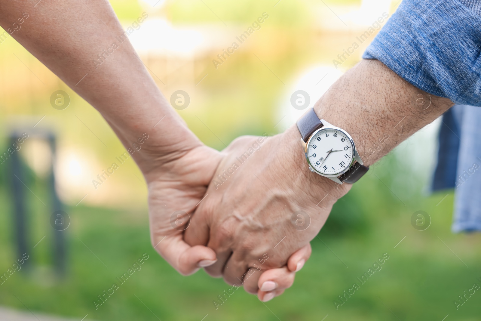 Lovely senior couple walking together outdoors, closeup Photo of Lovely senior couple walking together outdoors, closeup