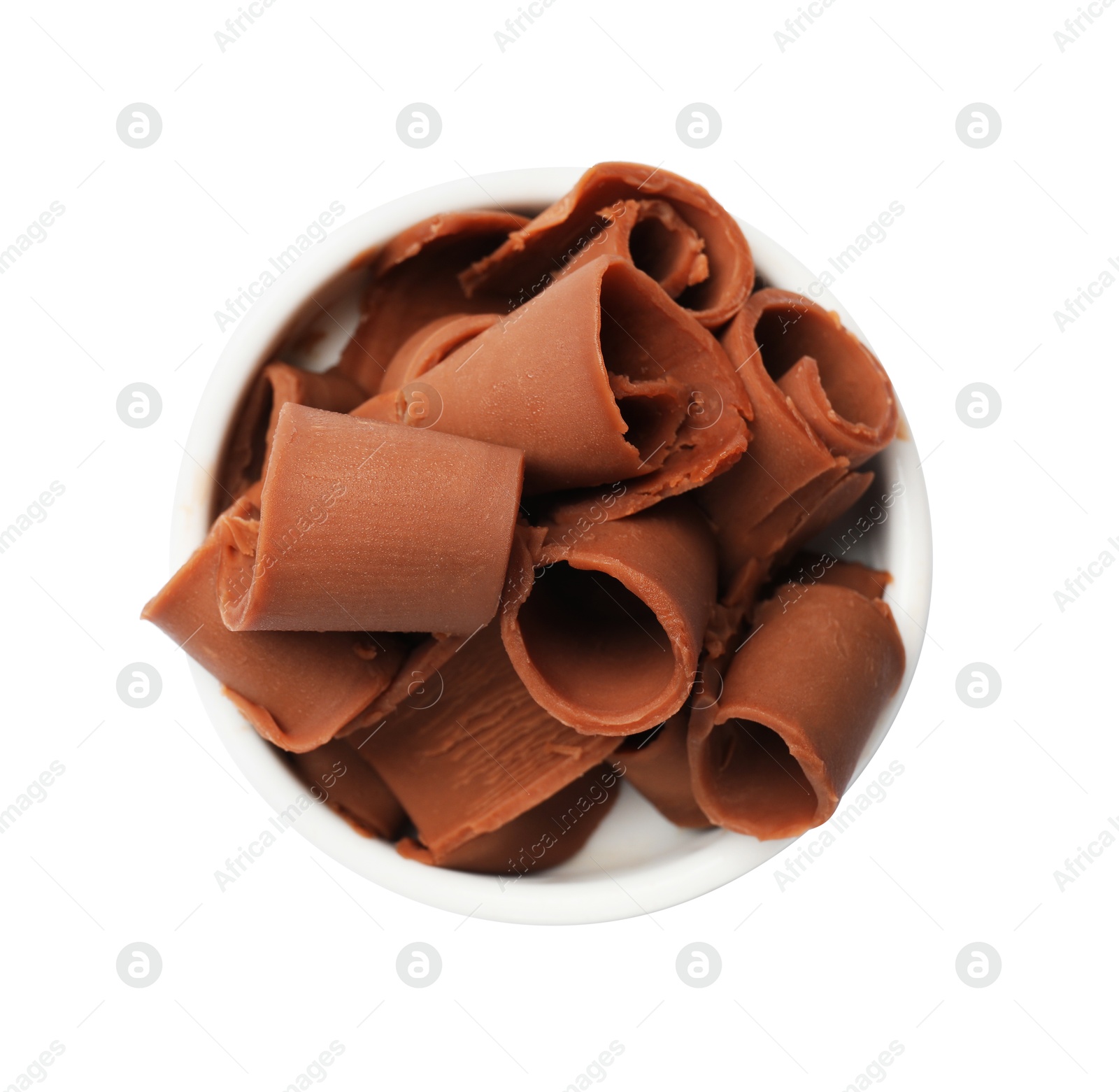 Tasty chocolate butter shavings in bowl isolated on white, top view Photo of Tasty chocolate butter shavings in bowl isolated on white, top view