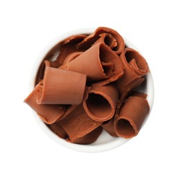 Photo of Tasty chocolate butter shavings in bowl isolated on white, top view