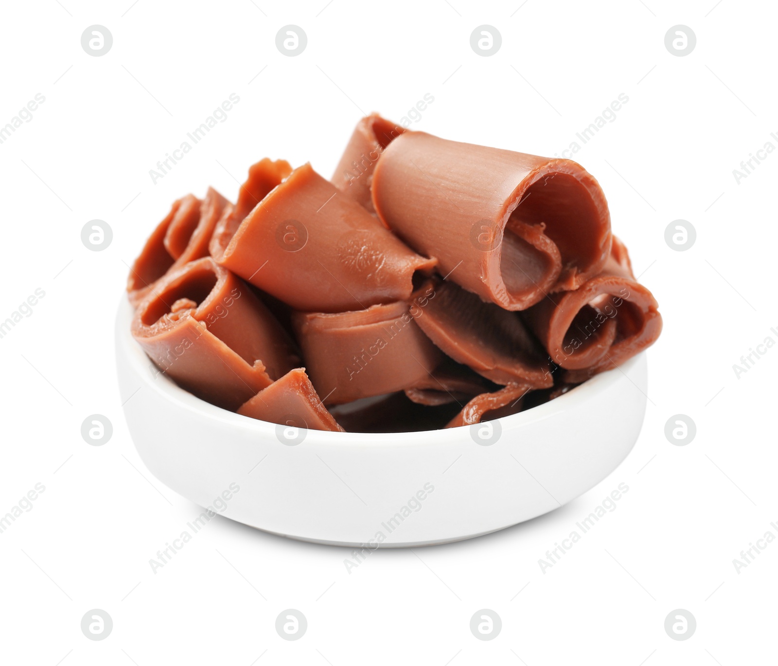 Photo of Tasty chocolate butter shavings in bowl isolated on white