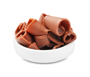 Photo of Tasty chocolate butter shavings in bowl isolated on white