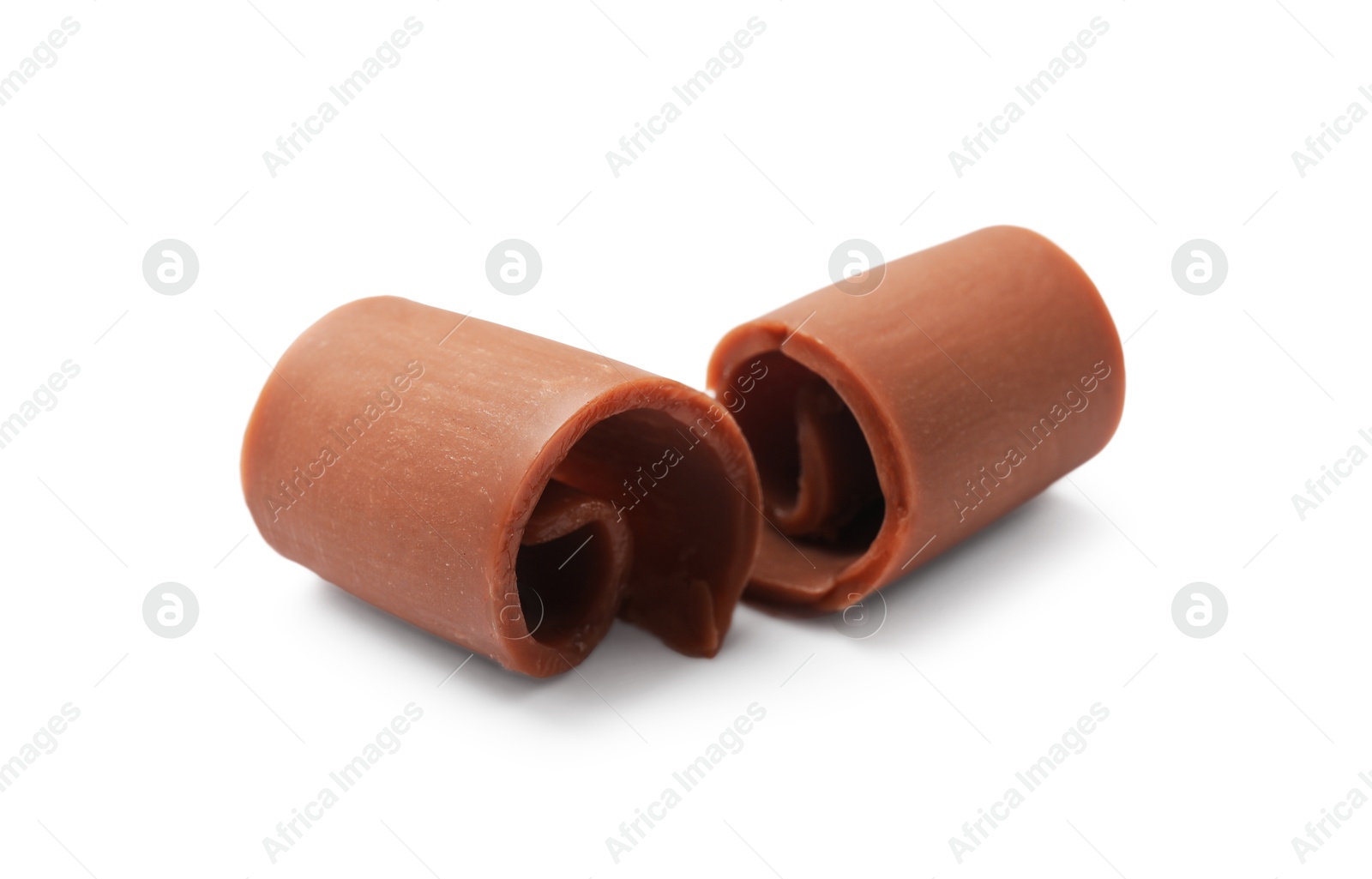 Tasty chocolate butter shavings isolated on white Photo of Tasty chocolate butter shavings isolated on white
