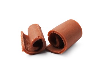 Photo of Tasty chocolate butter shavings isolated on white