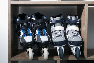 Photo of Pairs of roller skates in shelving unit, closeup