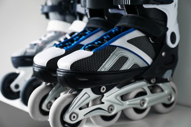 Photo of Pairs of roller skates in shelving unit, closeup