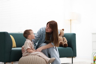 Photo of Happy mother spending time together with her son at home