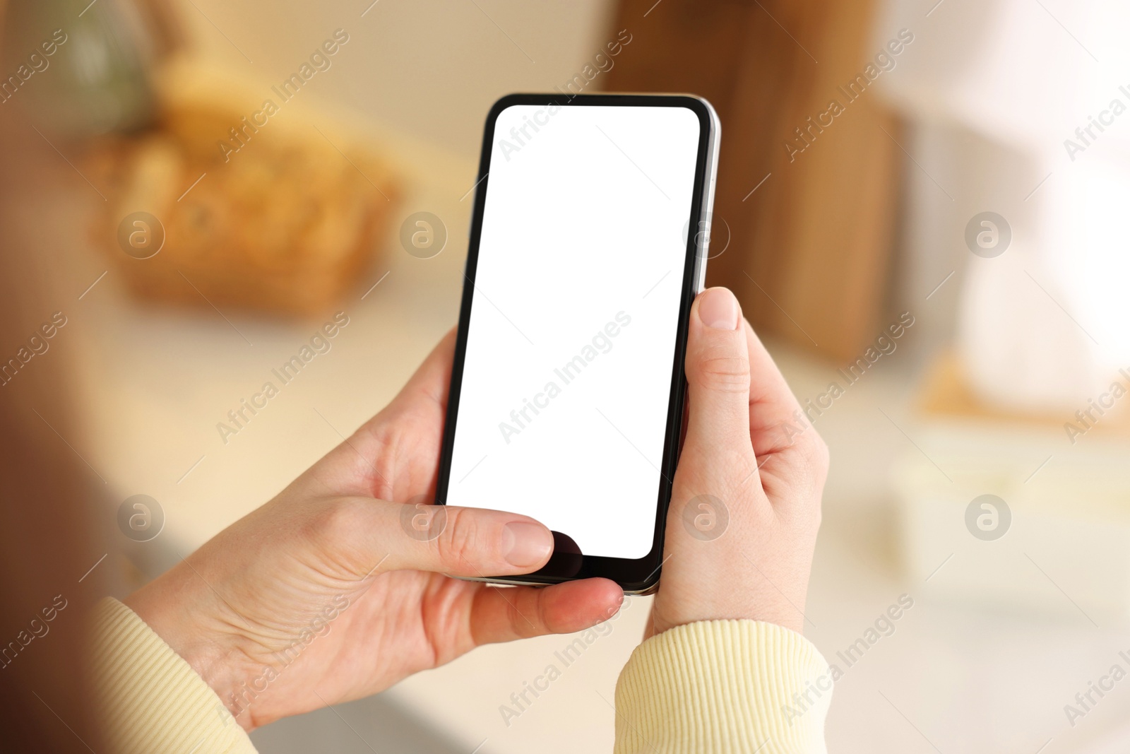 Woman using modern smartphone at home, closeup Photo of Woman using modern smartphone at home, closeup