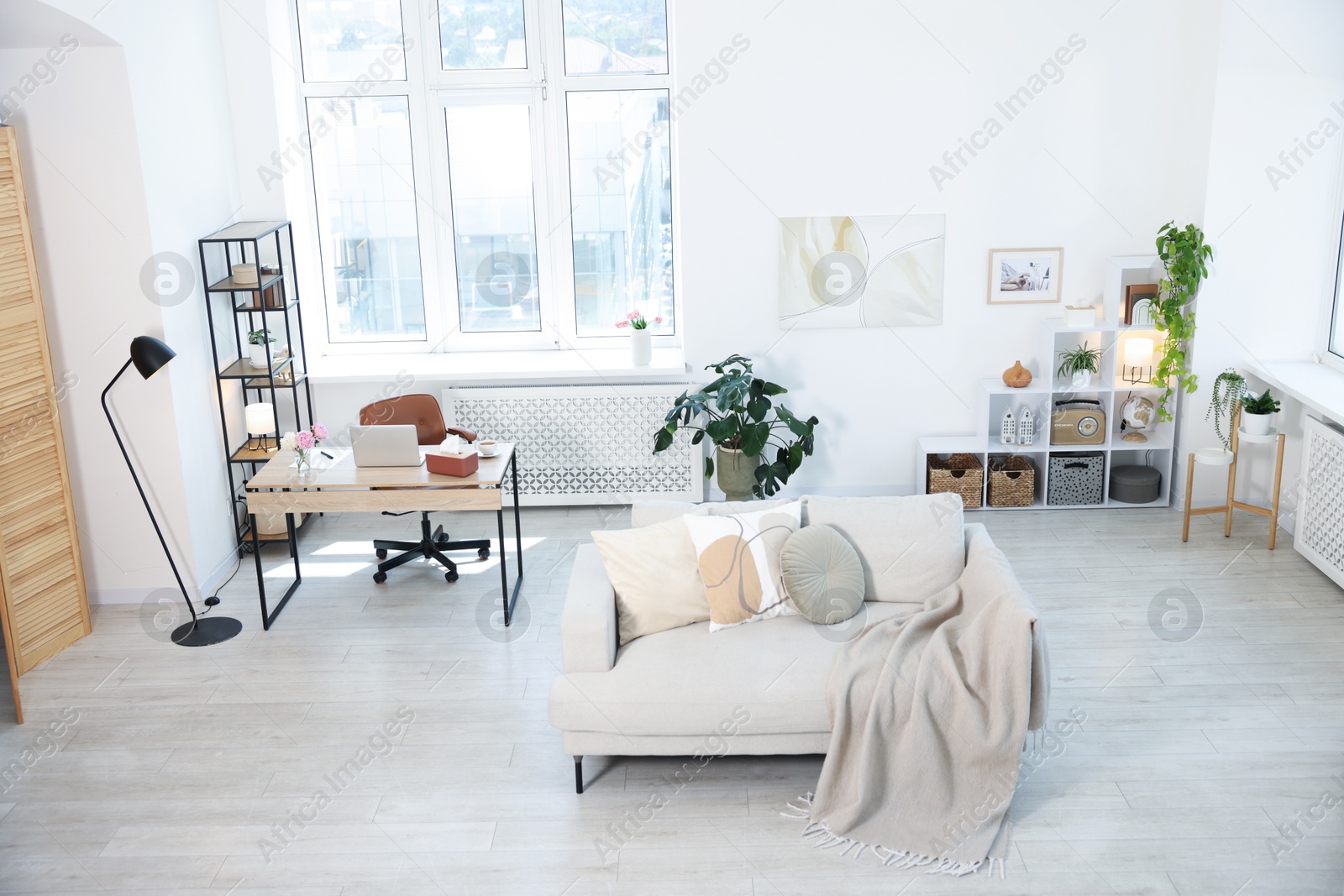Comfortable sofa and desk in room, above view Photo of Comfortable sofa and desk in room, above view