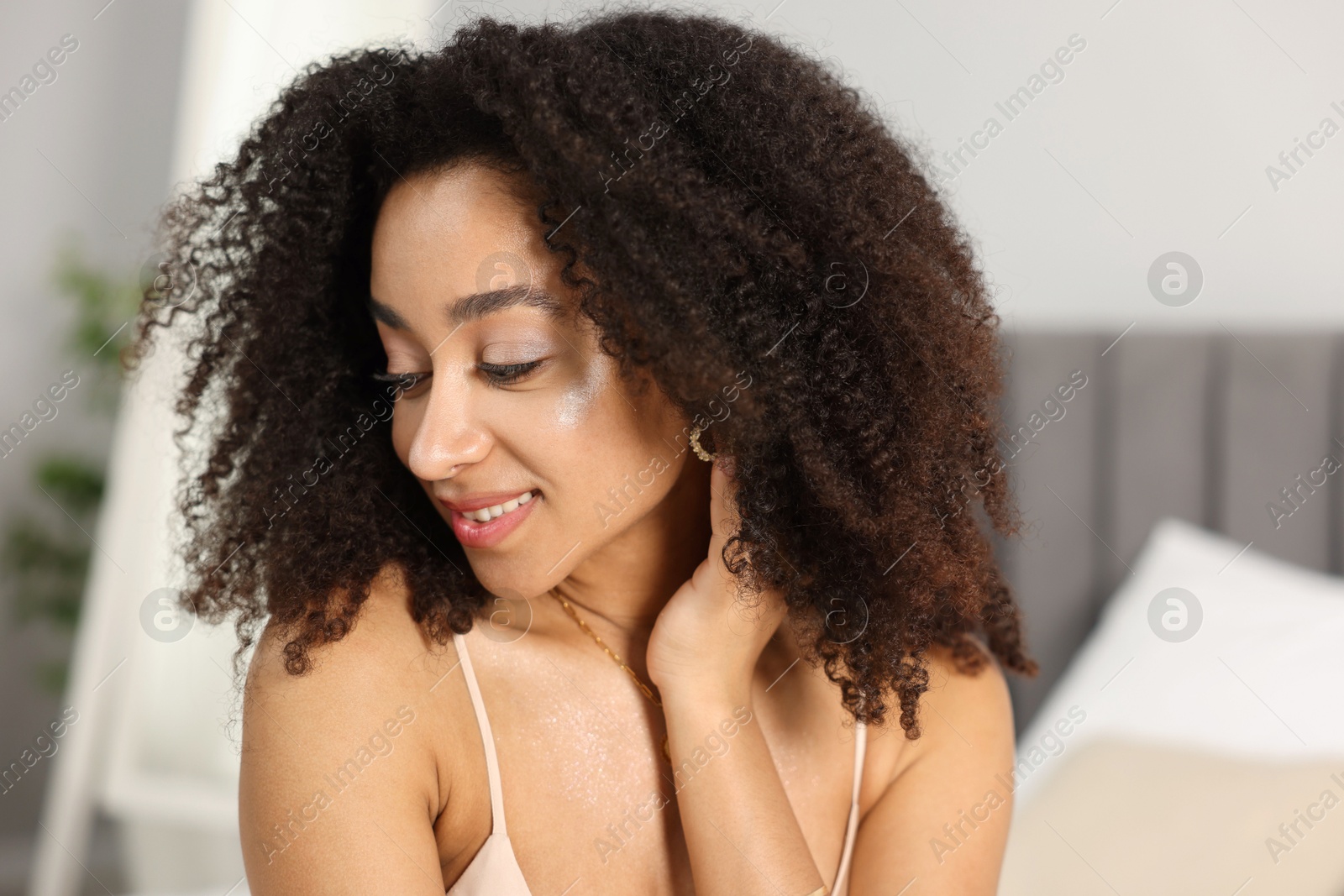 Beautiful smiling Brazilian woman with curly hair indoors Photo of Beautiful smiling Brazilian woman with curly hair indoors