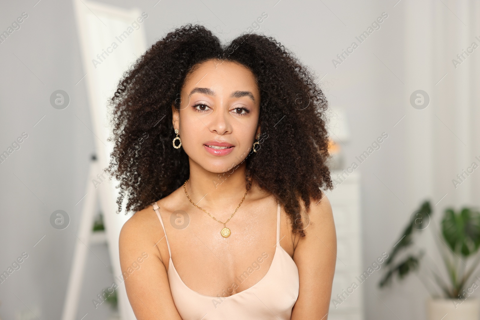 Beautiful Brazilian woman with curly hair indoors Photo of Beautiful Brazilian woman with curly hair indoors