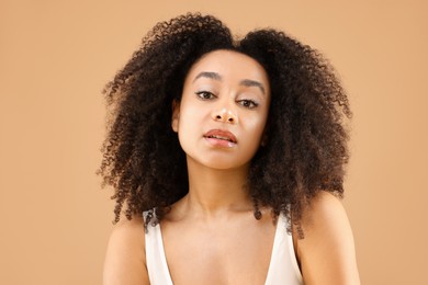 Photo of Portrait of beautiful Brazilian woman on beige background