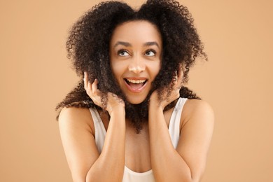 Photo of Portrait of beautiful Brazilian woman on beige background