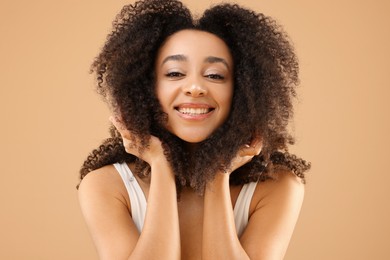 Photo of Portrait of beautiful Brazilian woman on beige background
