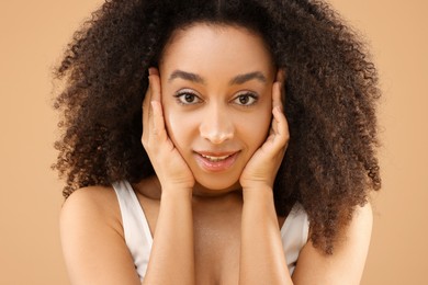 Photo of Portrait of beautiful Brazilian woman on beige background