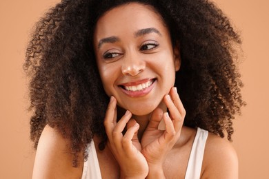 Photo of Portrait of beautiful Brazilian woman on beige background