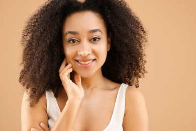 Photo of Portrait of beautiful Brazilian woman on beige background