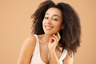 Photo of Portrait of beautiful Brazilian woman on beige background