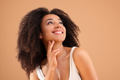 Photo of Portrait of beautiful Brazilian woman on beige background